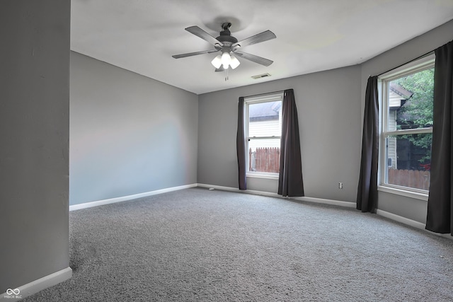 625 Maple St, Columbus, IN 47201 - carpeted empty room with baseboards, healthy amount of natural light, and ceiling fan