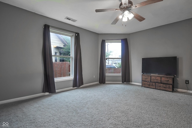 625 Maple St, Columbus, IN 47201 - unfurnished living room with carpet, baseboards, and a ceiling fan