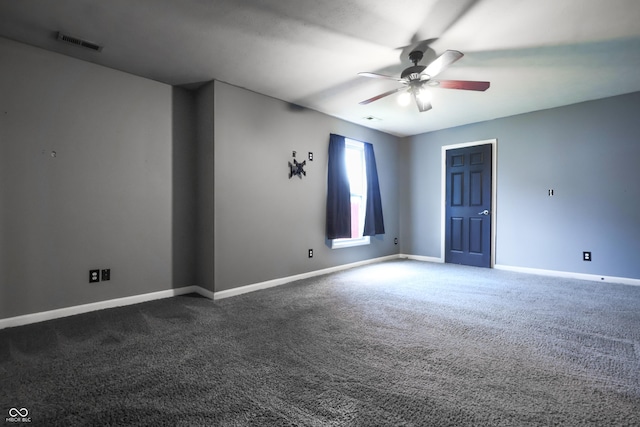 625 Maple St, Columbus, IN 47201 - empty room with a ceiling fan, dark carpet, and baseboards