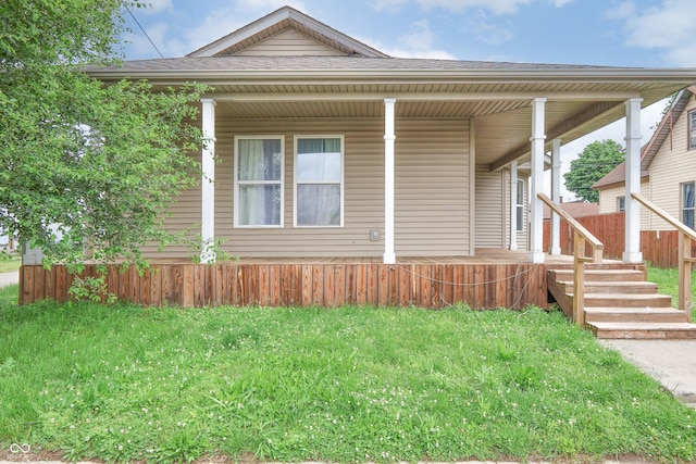 625 Maple St, Columbus, IN 47201 - view of front of house with covered porch, a shingled roof, and a front yard