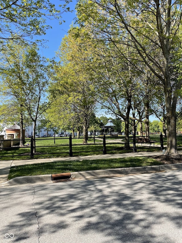 view of property's community with a yard