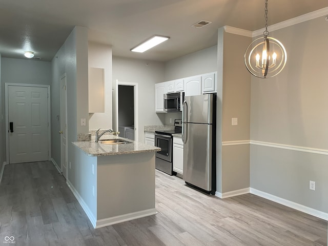 kitchen featuring visible vents, white cabinets, a chandelier, a sink, and appliances with stainless steel finishes