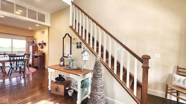 stairway with recessed lighting, baseboards, visible vents, and hardwood / wood-style flooring