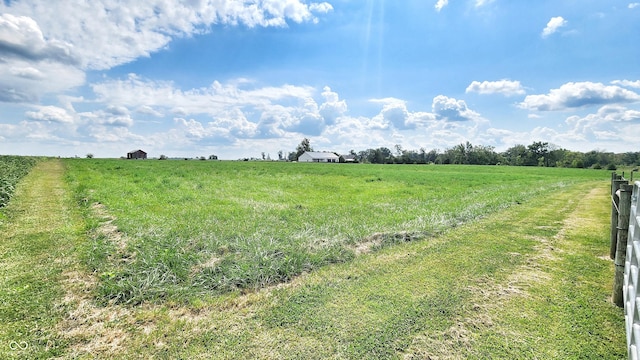 view of yard with a rural view
