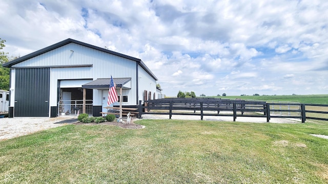 view of front of property featuring an exterior structure and an outdoor structure