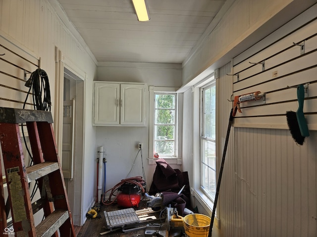 interior space with crown molding and wood finished floors