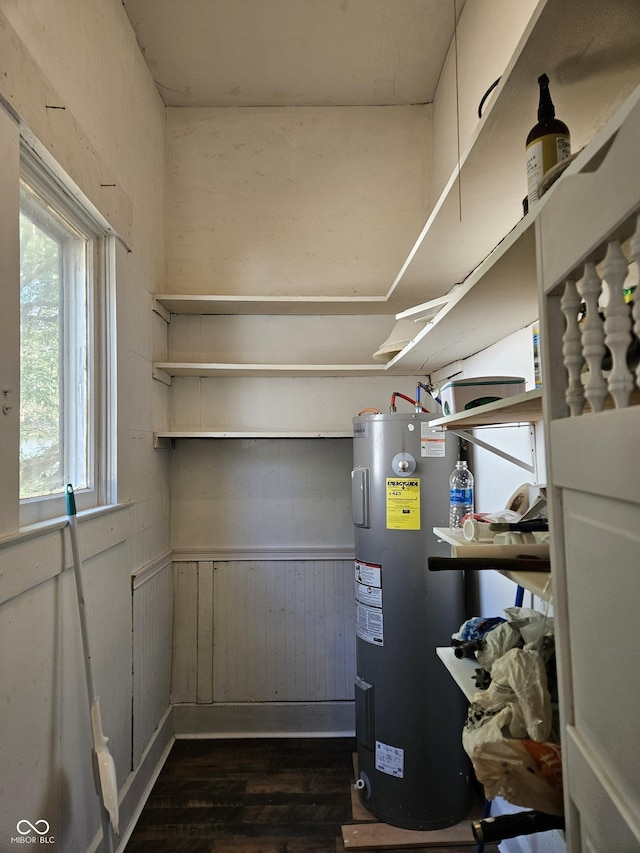 utility room with water heater