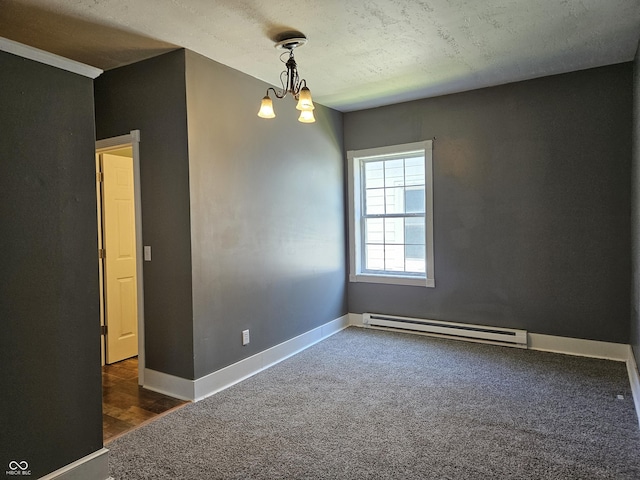 unfurnished room with baseboards, carpet floors, baseboard heating, and an inviting chandelier