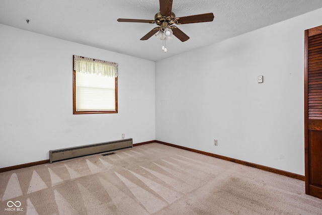carpeted empty room with baseboards, ceiling fan, and baseboard heating