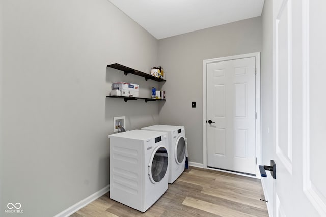 11595 Platt St, Noblesville, IN 46060 - washroom featuring washer and dryer, light wood-style floors, and baseboards