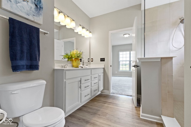 11595 Platt St, Noblesville, IN 46060 - full bathroom with double vanity, toilet, walk in shower, wood finished floors, and baseboards