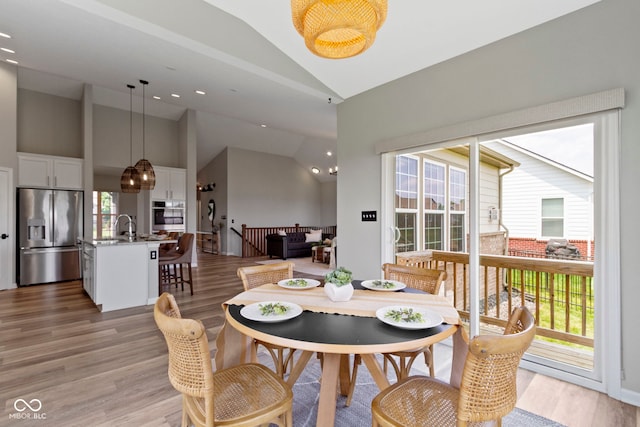 11595 Platt St, Noblesville, IN 46060 - dining area with light wood-style flooring, high vaulted ceiling, and recessed lighting