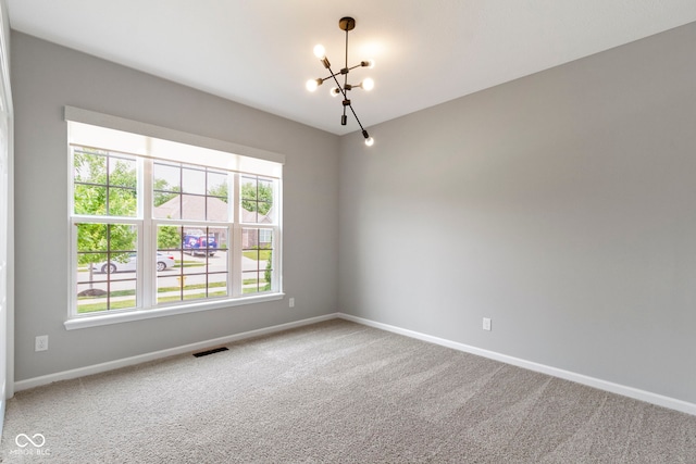 11595 Platt St, Noblesville, IN 46060 - carpeted spare room featuring a chandelier and baseboards