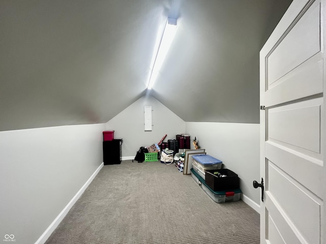 bonus room with baseboards, carpet flooring, and lofted ceiling