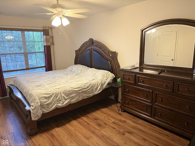 bedroom with a ceiling fan and wood finished floors