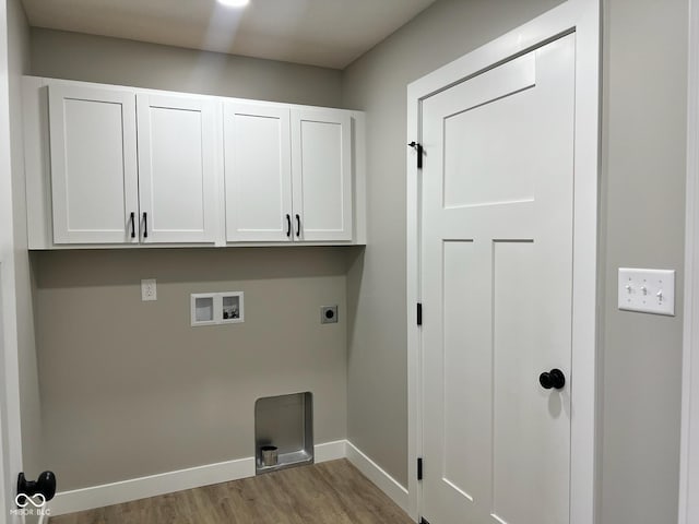 washroom featuring wood finished floors, baseboards, hookup for a washing machine, electric dryer hookup, and cabinet space