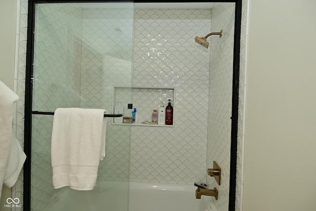 bathroom featuring walk in shower and a washtub