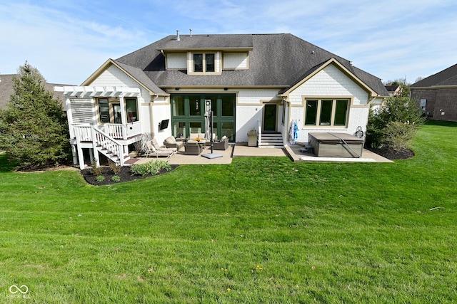 back of house with a hot tub, a patio, a pergola, a lawn, and outdoor lounge area