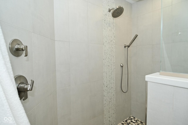 bathroom with tiled shower
