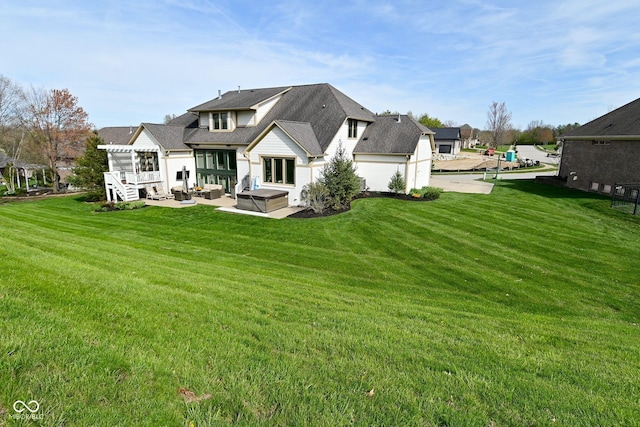 rear view of house featuring a yard, a patio area, and an outdoor living space