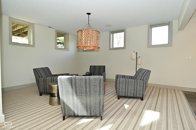 dining room with baseboards, carpet flooring, and plenty of natural light
