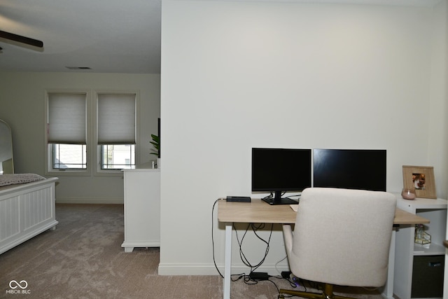 office area with carpet flooring, baseboards, a ceiling fan, and visible vents