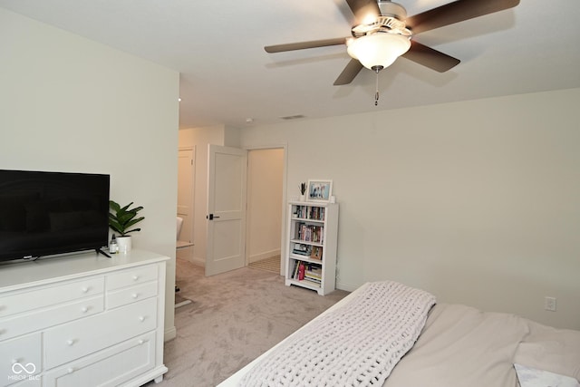 bedroom featuring a ceiling fan, light carpet, and visible vents