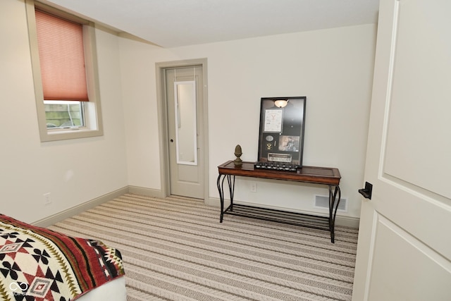bedroom featuring carpet floors, baseboards, and visible vents