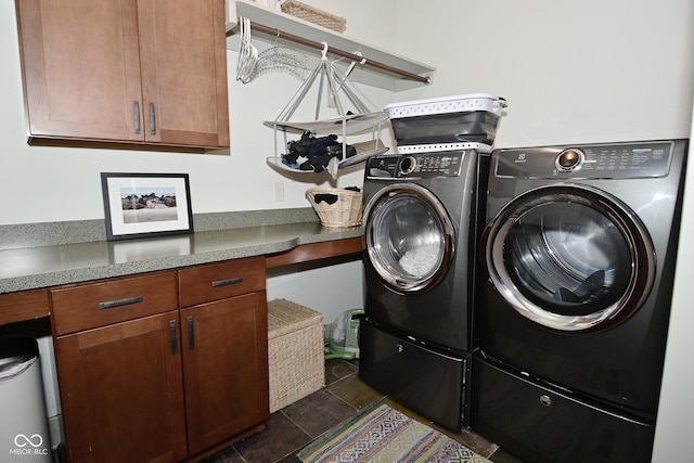 clothes washing area featuring cabinet space and washing machine and dryer