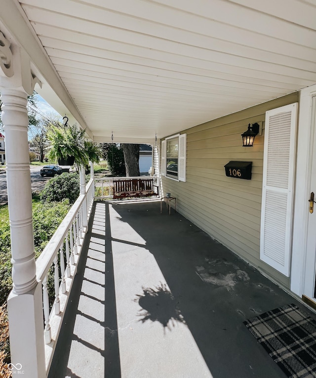 view of patio with a porch and an attached carport