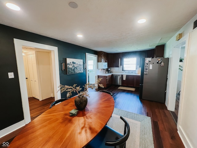 dining space featuring recessed lighting, dark wood finished floors, and baseboards