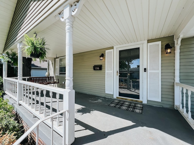 view of patio / terrace featuring covered porch and an attached carport