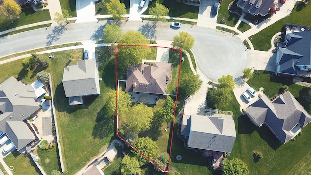 birds eye view of property with a residential view