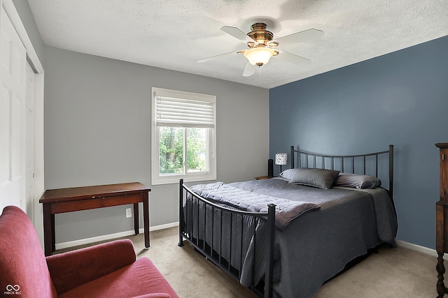 601 Shady Ln, Greenwood, IN 46142 - bedroom featuring baseboards, ceiling fan, light carpet, and a textured ceiling