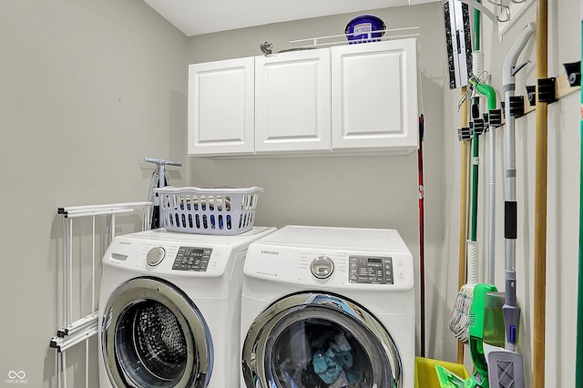 601 Shady Ln, Greenwood, IN 46142 - laundry room featuring washing machine and clothes dryer and cabinet space