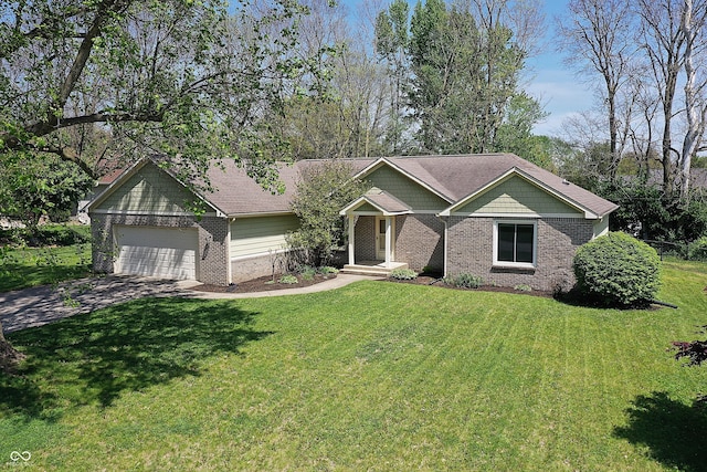 601 Shady Ln, Greenwood, IN 46142 - view of front of house with an attached garage, driveway, a front lawn, and brick siding