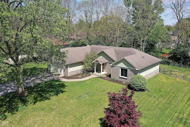 601 Shady Ln, Greenwood, IN 46142 - ranch-style home with an attached garage, a front lawn, fence, and driveway