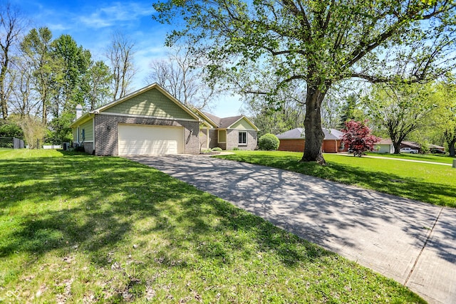 601 Shady Ln, Greenwood, IN 46142 - single story home featuring brick siding, an attached garage, driveway, and a front yard