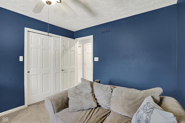 601 Shady Ln, Greenwood, IN 46142 - interior space featuring a ceiling fan, a textured ceiling, visible vents, carpet floors, and baseboards