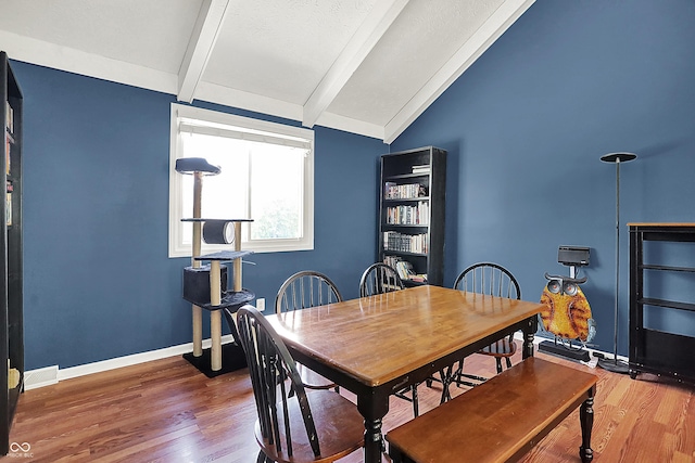 601 Shady Ln, Greenwood, IN 46142 - dining room featuring baseboards, lofted ceiling with beams, and wood finished floors
