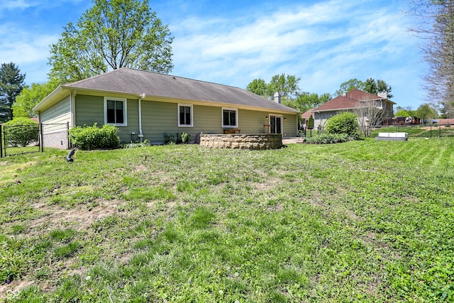 601 Shady Ln, Greenwood, IN 46142 - rear view of property featuring a garage, fence, and a yard