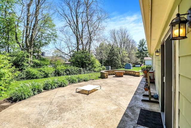 601 Shady Ln, Greenwood, IN 46142 - view of patio with an outdoor fire pit