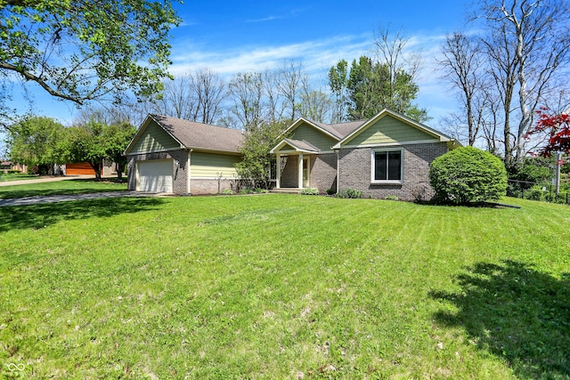 601 Shady Ln, Greenwood, IN 46142 - view of front of property featuring an attached garage, a front lawn, driveway, and brick siding