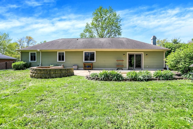601 Shady Ln, Greenwood, IN 46142 - back of house featuring a patio area, a yard, and a chimney