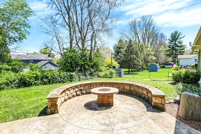 601 Shady Ln, Greenwood, IN 46142 - view of patio featuring fence and an outdoor fire pit