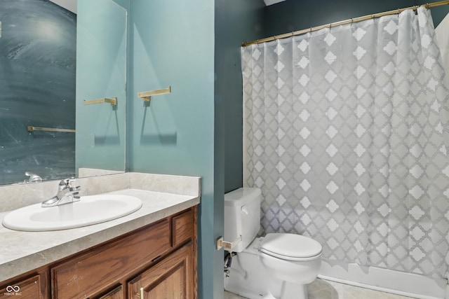 bathroom featuring toilet, vanity, and a shower with curtain