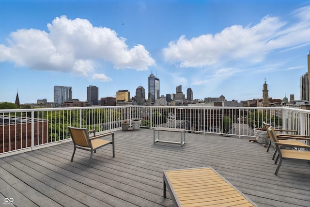 wooden terrace with a skyline view