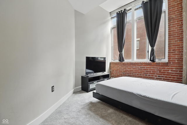 carpeted bedroom featuring baseboards