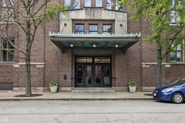 entrance to property with french doors and brick siding