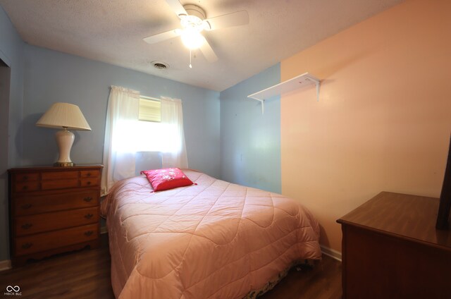 5041 Norcroft Dr, Indianapolis, IN 46221 - bedroom with baseboards, ceiling fan, dark wood finished floors, and visible vents